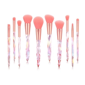 Detail of 10-piece crystal makeup brush set with pink bristles and diamond handles