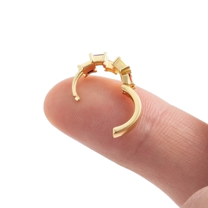 Gold-plated S925 silver cartilage hoop earring with rectangle pink zircon on fingers