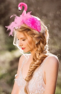 Detailed view of pink flamingo headband with feathers worn by a model for cosplay