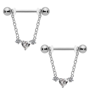 Macro view of heart-shaped zircon nipple rings with dangling metal chains in silver