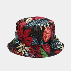 Close-up of tropical leaf print on black canvas fabric of this reversible sun bucket hat