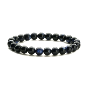 Macro shot of natural purple imperial stone beads and blue tiger eye on elastic bracelet