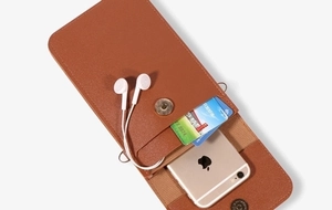 Detail view of brown pebbled leather phone bag with magnetic flap and internal card slots