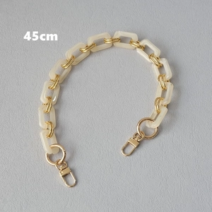 Detail view of 45cm cream resin and gold link chain strap for bags and mobile phones