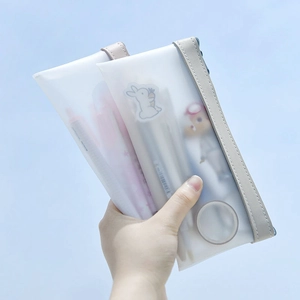 Translucent frosted pencil case with beige leather handle and cute cartoon patterns