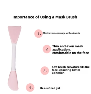 Dual-head silicone face mask brush with pink fan tip and flat spatula for smooth application