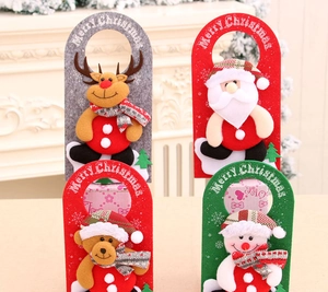 Detailed view of four felt Christmas door hangers with Santa, reindeer, bear, and snowman