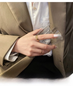 Close-up of a two-piece set of 18K gold plated stackable rings on a model's hand