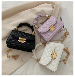 Three elegant quilted crossbody bags in black, purple, and white with gold chain straps