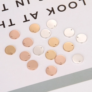 Polished round metal pendant charms in gold, silver, and rose gold for DIY jewelry making