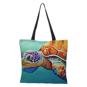 Detailed close-up of vibrant 3D sea turtle print on waterproof linen tote bag texture