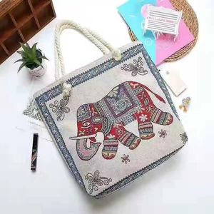 Close-up of ethnic elephant print on canvas tote bag with thick cotton rope handles