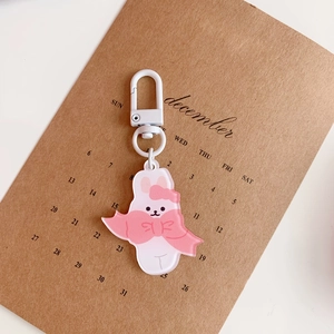 Detailed close-up of a pink acrylic bunny keychain with a white metal lobster clasp