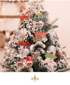 Detail of wooden Christmas car pendants hanging on a festive tree with lights