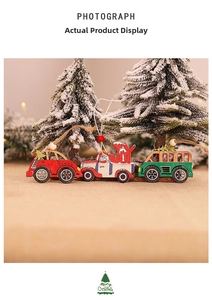 Three wooden Christmas ornaments featuring red car, white JOY van, and green bus on snow