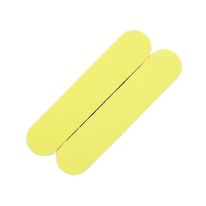 Close-up of yellow mini sponge nail files with rounded ends and grainy texture