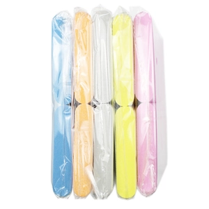Mini multi-colored sponge nail buffers organized in clear plastic packaging packs