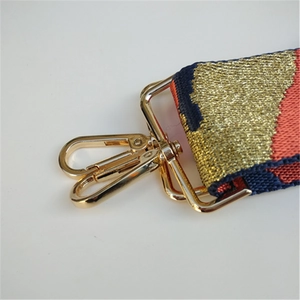 Detail of 5cm wide camouflage star strap with gold metal hooks for crossbody bags