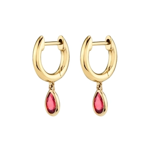 Close-up of gold C-shape hoop earrings with red pear-cut zircon crystal pendants
