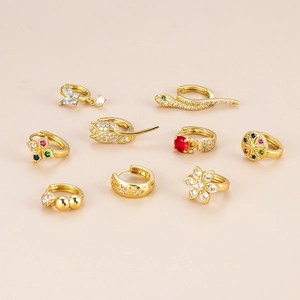 Golden stud earring set with snake, flower, and star motifs featuring sparkly zircons