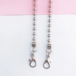 Detail showing polished silver bead chain strap with large lobster clasp for phone cases