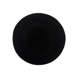 Classic black wool beret hat for women with a flat top and stem on white background
