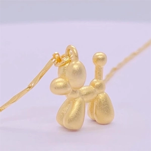 Matte gold balloon dog pendant necklace in pop art style for modern fashion