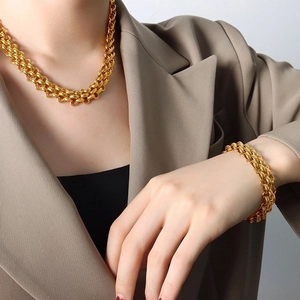 Gold-plated chunky chain necklace and bracelet set with circular ring link design