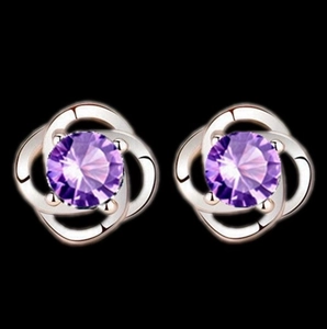 Elegant silver four-leaf clover stud earrings with faceted round purple crystal stones