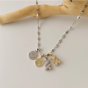 Titanium necklace with heart chain and micro-set zircon bear and smiley face pendants