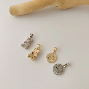 Titanium steel necklace with pave zircon bear and smiley face pendants in gold and silver