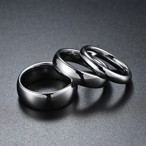 Macro shot of three gunmetal tungsten rings with high polish finish in various widths
