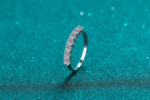 Macro side view of 925 sterling silver ring with seven round brilliant cut moissanite stones