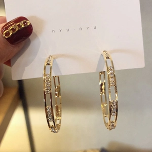 Minimalist gold-tone C-shaped hoop earrings with sparkling crystal accents for women
