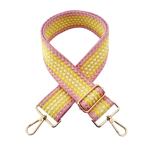 Detail of thickened pink and yellow woven replacement strap with golden metal lobster clasps