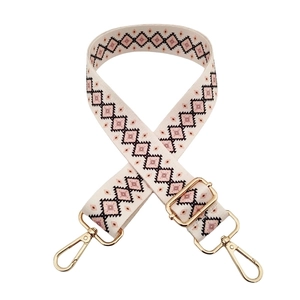 Detail of bohemian geometric woven replacement strap with polished gold-tone hardware