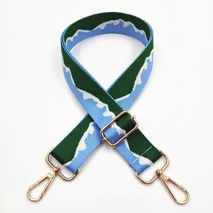 Adjustable woven replacement bag strap with green mountain jacquard and gold metal hooks