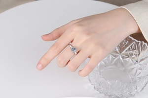 Close-up of S925 sterling silver ring with a twisted band and large round moissanite