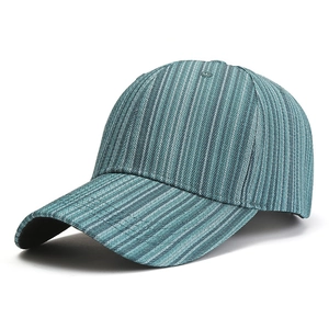 Minimalist striped baseball cap in teal with vertical white textures and curved brim
