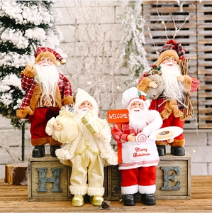 Detail of four creative standing Santa Claus dolls with festive bags and welcome signs