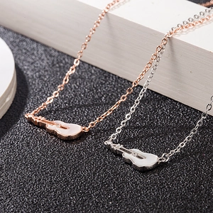 S925 sterling silver guitar pendant necklace in rose gold and silver on geometric stands