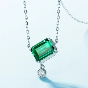 S925 silver necklace with emerald cut green gemstone and shimmering white cubic zirconia