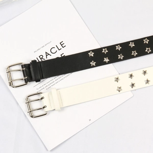 Detail of punk style star hollow double grommet belt with silver metal buckles