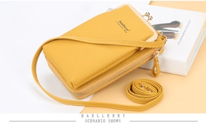 Detailed view of yellow litchi pattern leather phone crossbody bag with metal clasp