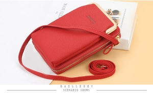 Detailed view of red litchi texture multi-layer crossbody phone bag with metal kiss-lock
