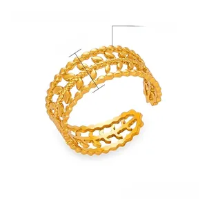 Detail view of gold titanium steel ring featuring hollow olive leaf pattern and adjustable size