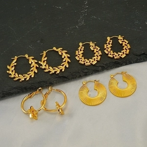 Gold-plated stainless steel hoop earrings set featuring star pendants and textured designs