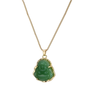 Elegant gold-tone chain necklace with emerald green Buddha pendant on white background