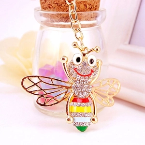 Cute golden bumblebee keychain with sparkling crystals and colorful enamel stripes