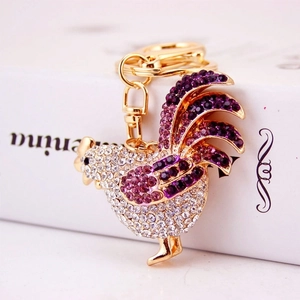 Golden rooster keychain set with sparkling purple and clear rhinestones for handbags